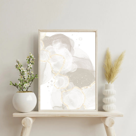 Abstract art, taupe White and gold, embellished, displayed in frame on shelf.