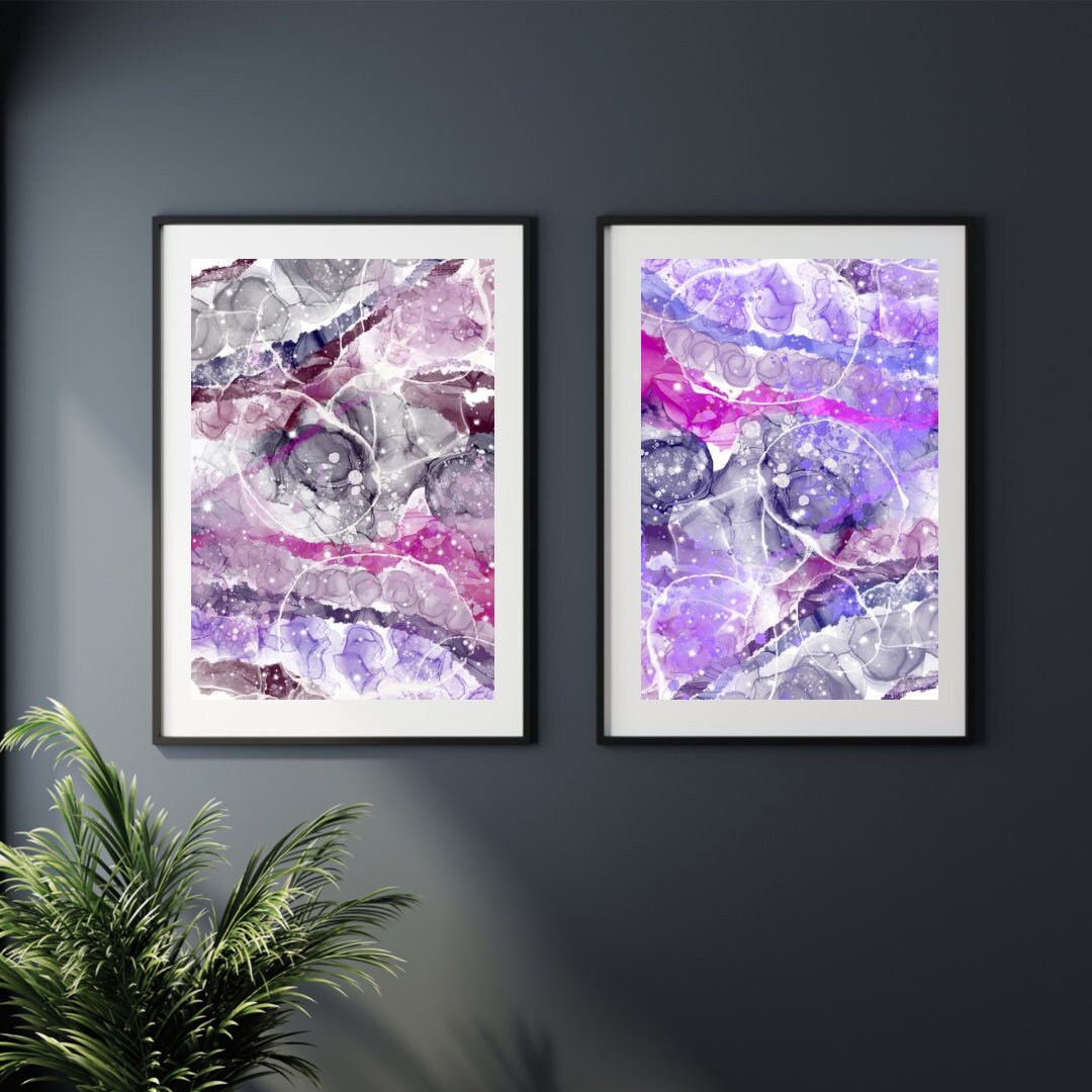 Abstract graffiti art prints, spiritual wall art, pink and purple, set of 2 displayed in mounted frames.