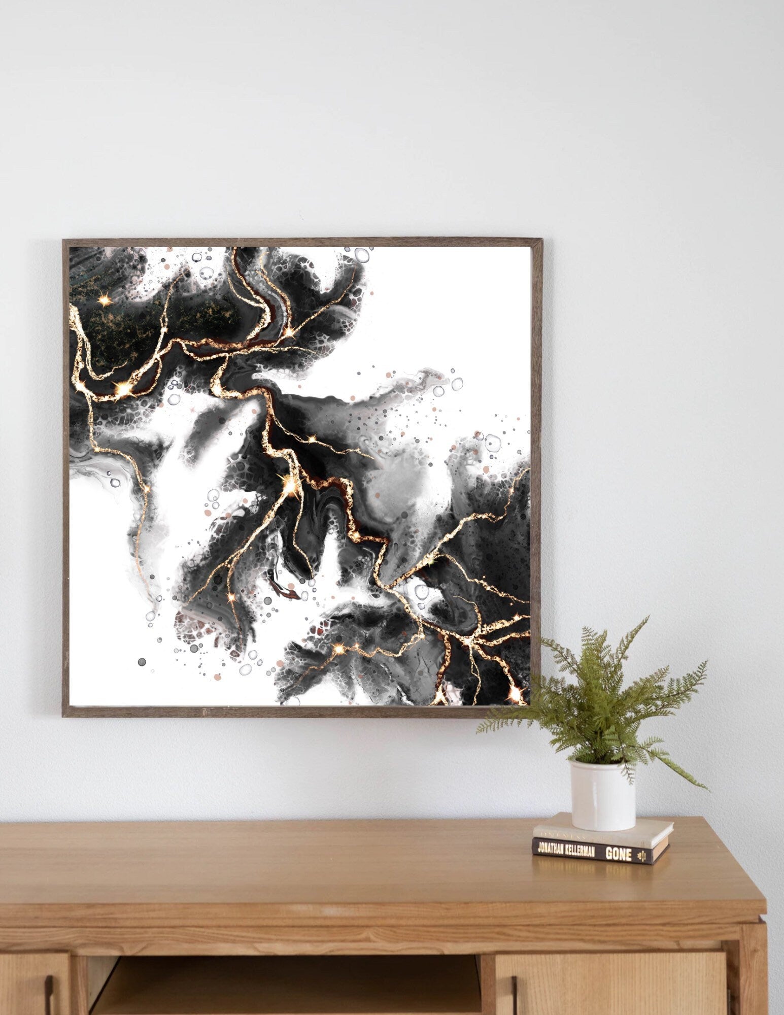 Abstract art print, spiritual wall art, black and gold, shown in mounted frame.