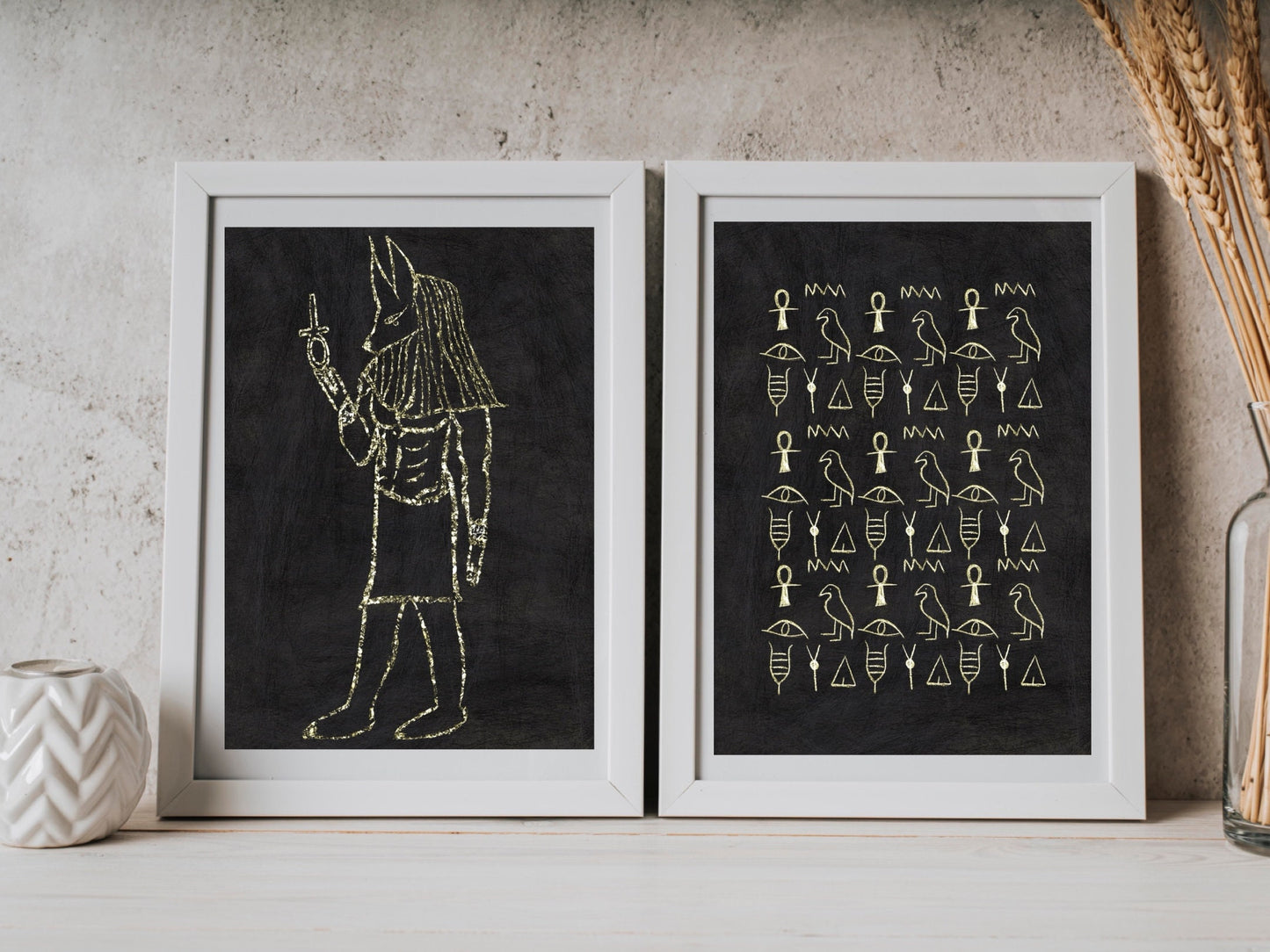 Spiritual wall art, ancient Egyptian art prints, black and gold, set of two art prints displayed in mounted frames.