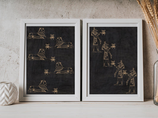 Spiritual wall art, ancient Egyptian art prints, black and gold, set of two art prints displayed in mounted frames.