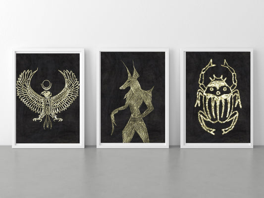 Spiritual wall art, ancient Egyptian art prints, black and gold, set of three art prints displayed in mounted frames.